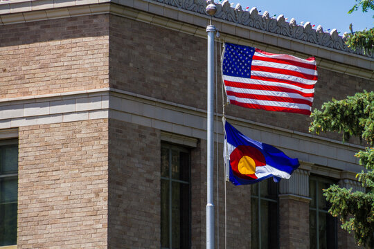 American and Colorado State Flags Waving, Colorado