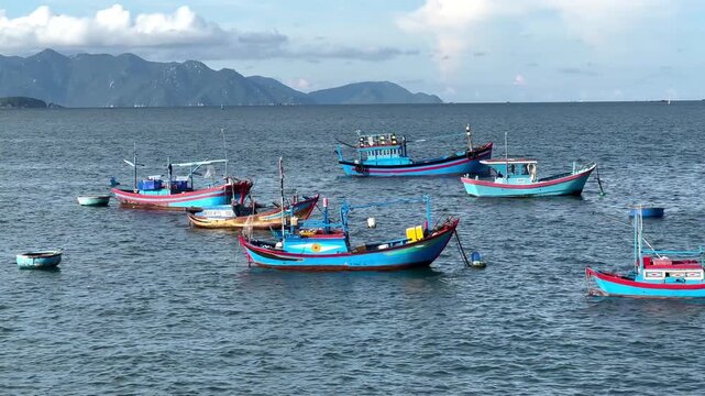 Traditional Vietnamese fishing boats anchored in scenic bay