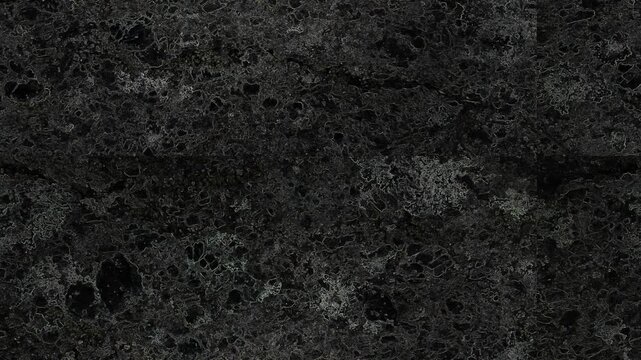 Dark abstract textured surface featuring intricate organic patterns, shadows, cracks, and mysterious depth throughout. Grunge texture background animation.