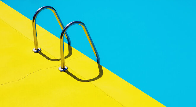 Minimalist view of a swimming pool with bright yellow deck and blue water, featuring metal handrails casting shadows.