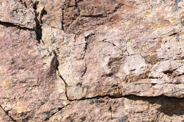 Fototapeta premium Natural Cracked Rock Texture Background with Earth Tones