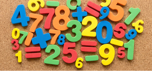 Fototapeta premium Colorful wooden math symbols, numbers and equations, educational alphabet, learning tools