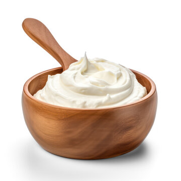 A wooden bowl contains a generous portion of thick, creamy yogurt. A wooden spoon rests inside the bowl, ready to scoop up the yogurt.
