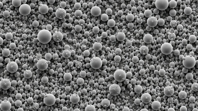 Scanning electron microscope image showing dense array of spherical polymer bead on flat substrate surface with uniform morphology and particle size distribution
