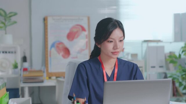Doctor entering electronic medical records. Medical, asian woman working with computer in medical consultation at hospital. which are recording diagnoses and patient symptoms. Healthcare and medicine
