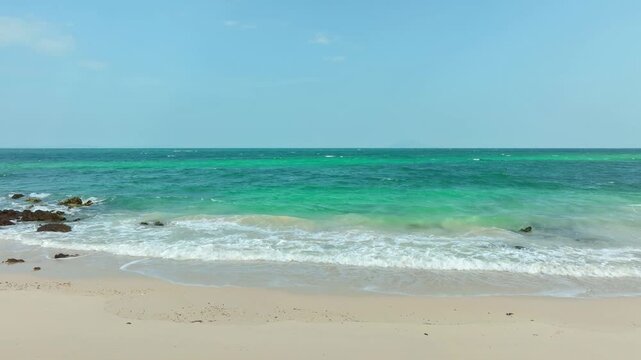 Tropical Nature sand sea and summer sea water with beautiful bright sunlight. Perfect for summer vacation and travel background	