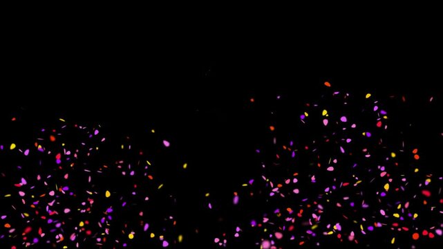 Vibrant fireworks exploding with colorful confetti on black background