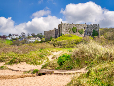 Manorbier, the village, the beach and the castle. The castle lies directly on the coast path and is just above the beach.