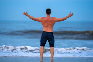 Body muscular concept. Body opens arms to sky. Body feels calm and peace. Body enjoys fitness and wellness.