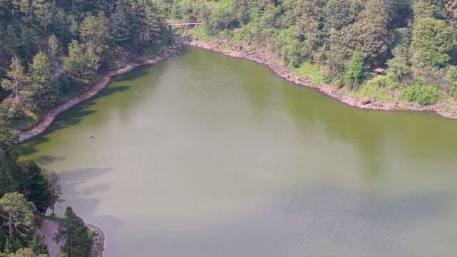 Elevated view of the Zempoala Lagoons surrounded by forests and mountains