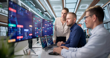 Naklejka premium Diverse Team Works Together Building Software