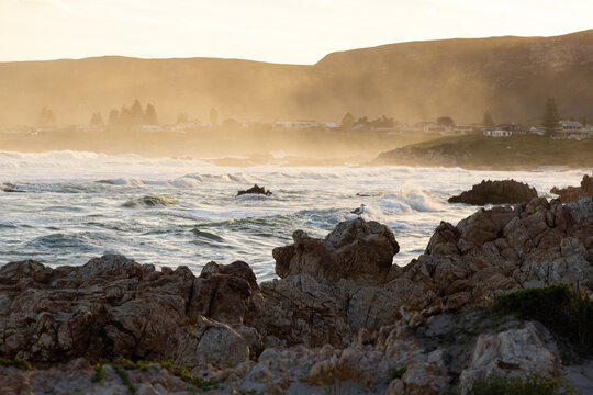 Sunset and dusk settling over beautiful Kammabaai Beach, Hermanus, South Africa