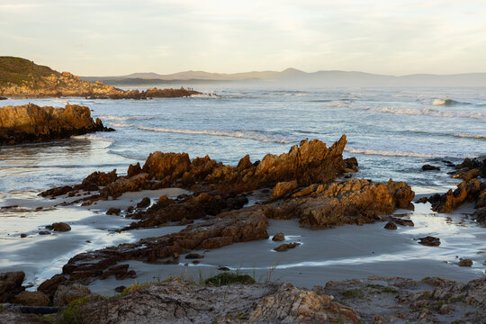 Sunset and dusk settling over beautiful Kammabaai Beach, Hermanus, South Africa