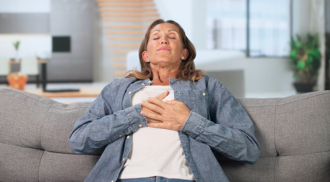 Older Woman Sits Quietly At Home