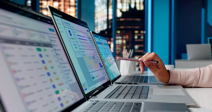 Young Hispanic Woman Reviewing Employee Performance And Attendance Data
