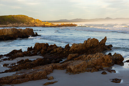 Sunset and dusk settling over beautiful Kammabaai Beach, Hermanus, South Africa