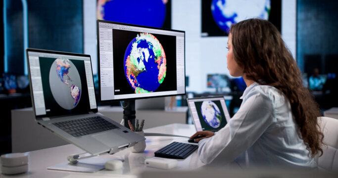 Young Female Meteorologist Analyzes Weather Maps