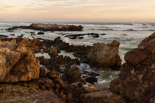 Sunset and dusk settling over beautiful Kammabaai Beach, Hermanus, South Africa