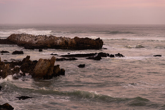 Sunset and dusk settling over beautiful Kammabaai Beach, Hermanus, South Africa