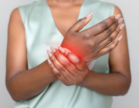 Woman Experiencing Wrist Pain - Medical and Healthcare Concept.