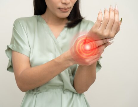 Woman Experiencing Wrist Pain - Medical Concept of Injury and Inflammation.