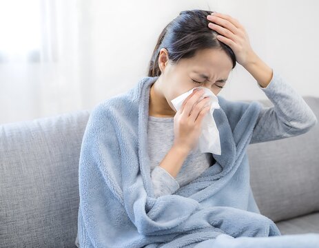 Woman Suffering from Cold or Flu Symptoms at Home, Feeling Unwell.