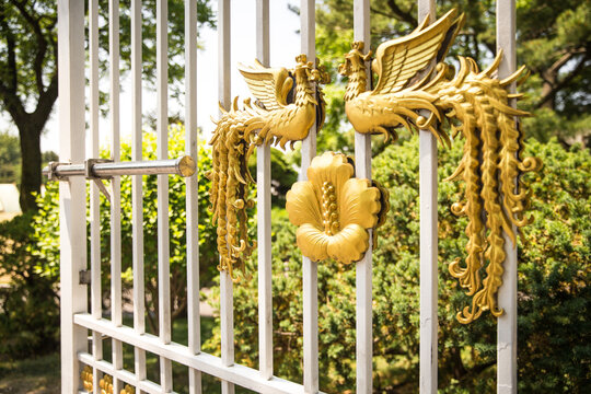 The golden phoenix pattern on the main gate of the Blue House in South Korea