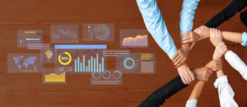 Team Collaboration on Data Analysis with Graphs and Charts Over a Wooden Table Showcasing Statistics and Trends in a Modern Workspace. Entropy.