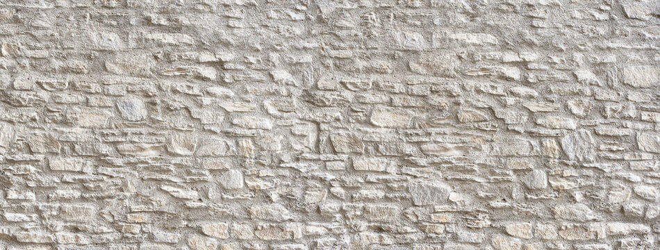 Stone wall texture presenting rough rustic masonry background