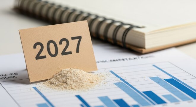 Detailed close-up of a business notebook with a year marker and financial data analysis.