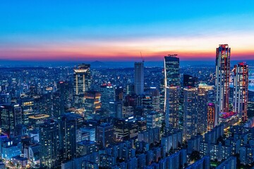 Fototapeta premium Beautiful night view of Yeouido financial district skyscrapers with bright office lights in Seoul, South Korea 
