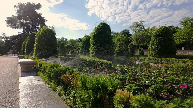 Automatic irrigation in the parterres of the Retiro Monumental Park, Madrid.