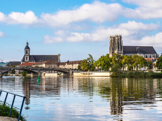 Obraz premium Church St Martin and Abbey of the Premontres in town Pont a Mousson on the Moselle River, France