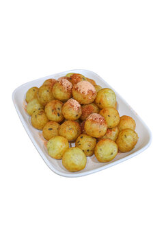 Fried tapioca balls seasoned with savory powder on white plate