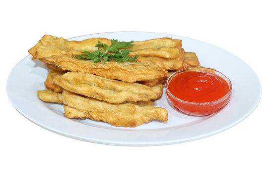 Crispy fried snacks served with hot chili dipping sauce on white plate