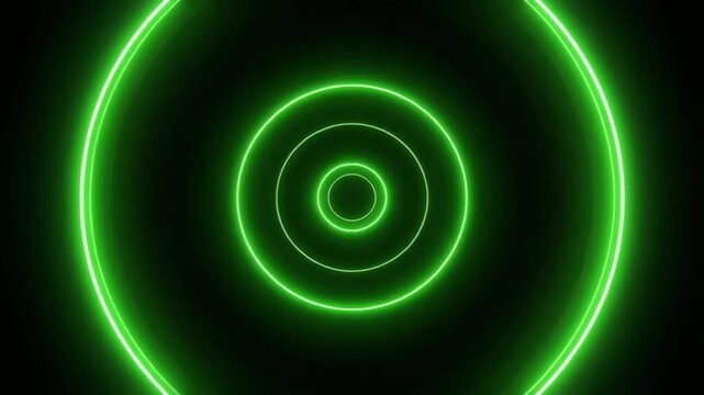 Green neon light forms concentric circles drifting upwards.