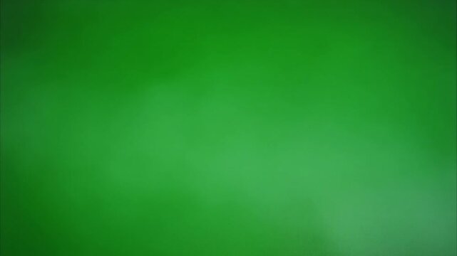 Thick smoke ribbon folds slowly on green screen plate with alpha motion.