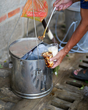 Traditional Filipino Taho Vendor Serving Fresh Taho Dessert