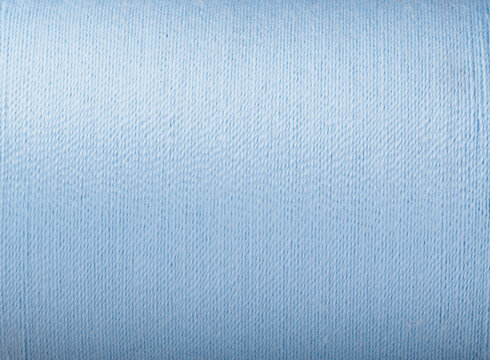 close up picture of light blue thread texture fabric background handcraft theme wallpaper textile material design interior backdrop