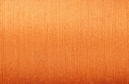 close up picture of orange thread texture fabric background handcraft theme wallpaper textile material design interior backdrop
