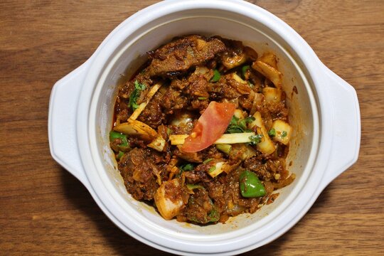 Food delivery: dry mutton curry