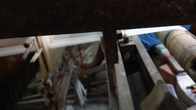 Handloom weaving machine crafting fabric closeup