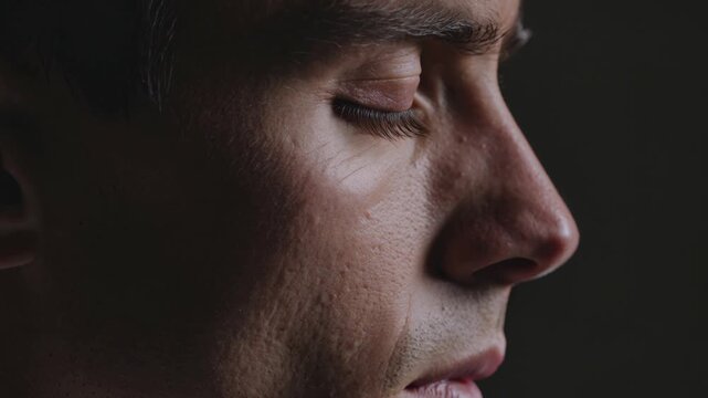 Man face profile, close up and serious expression for mental health awareness, skin care and cinematic lighting. Adult, male and side view with intense look, concentration and psychology portrait