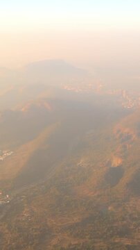 Shil Phata - Mahape Rd, MIDC Industrial Area, Mahape, Navi Mumbai, Maharashtra, India. Mumbai Metropolitan Region. Aerial View From Airplane Window On View of the Mumbai suburb district. Evening