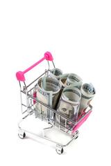Dollars in a shopping cart on a white background, business and finance © AI-Valentin