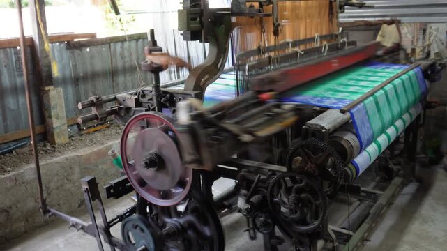 Vintage weaving loom crafting fabric with mechanical precision