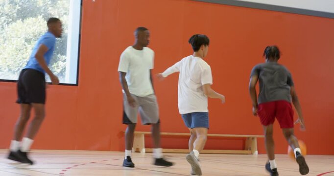 Dribbling male entering court, driving to hoop, shooting with friends scrambling for rebound