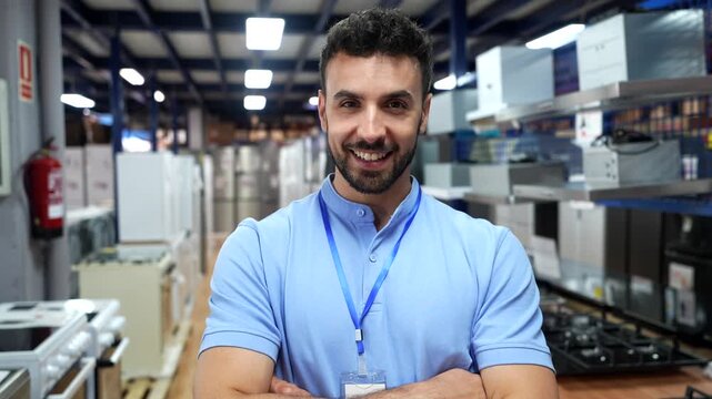 Confident salesman standing in home improvement appliance store