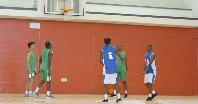 Missing free throw at school, asian male player scooping ball, dribbling upcourt and aiming