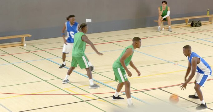Trap forcing guard pivoting and passing ball, green jersey defenders stealing, passing upcourt